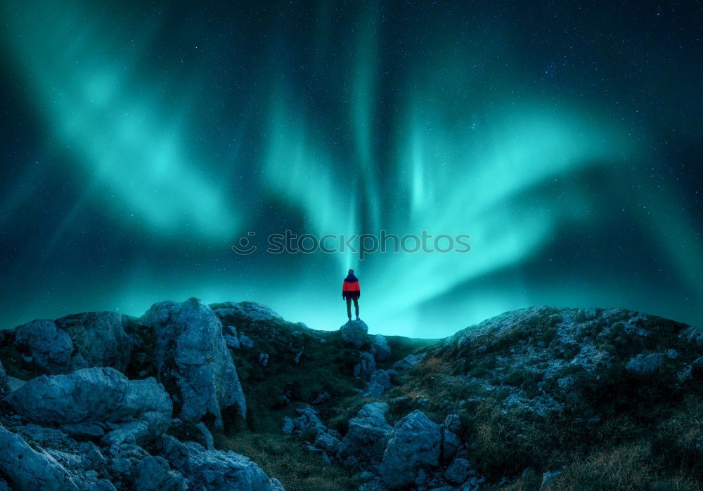 Similar – Norwegian mountain panorama with northern lights