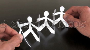 Similar – Paper made people figures