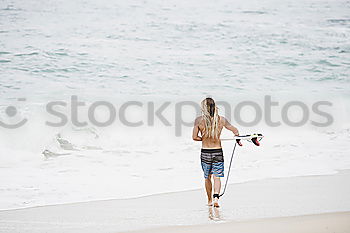 Similar – Image, Stock Photo caucasian mother and sun are walking into the water at the beach