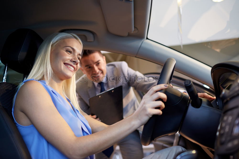 Similar – father teaching kid daughter to drive a car