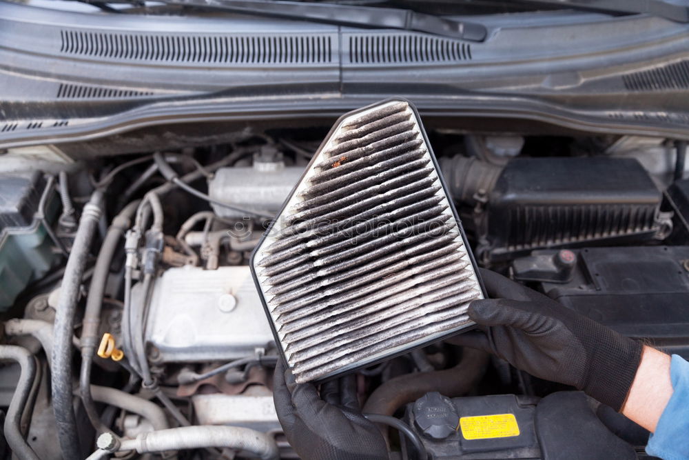 Similar – Professional Mechanic Repairing Car.