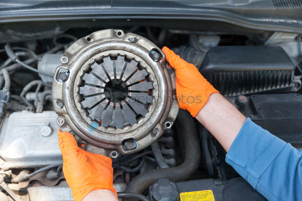 Similar – Professional Mechanic Repairing Car.