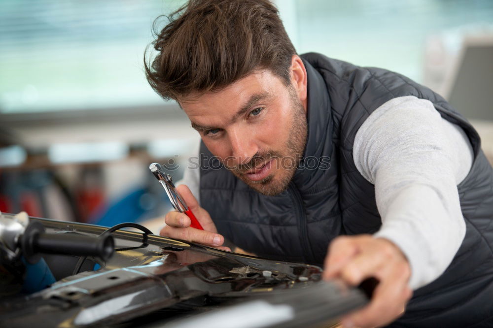 Similar – Image, Stock Photo Mechanic checking motorcycle