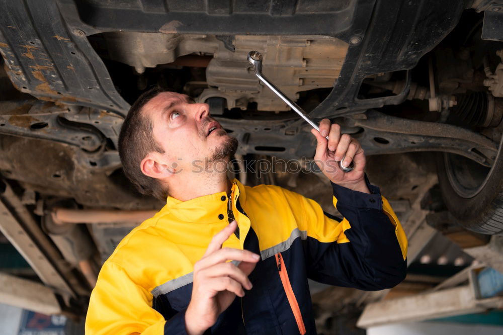 Similar – Image, Stock Photo Mechanic checking motorcycle