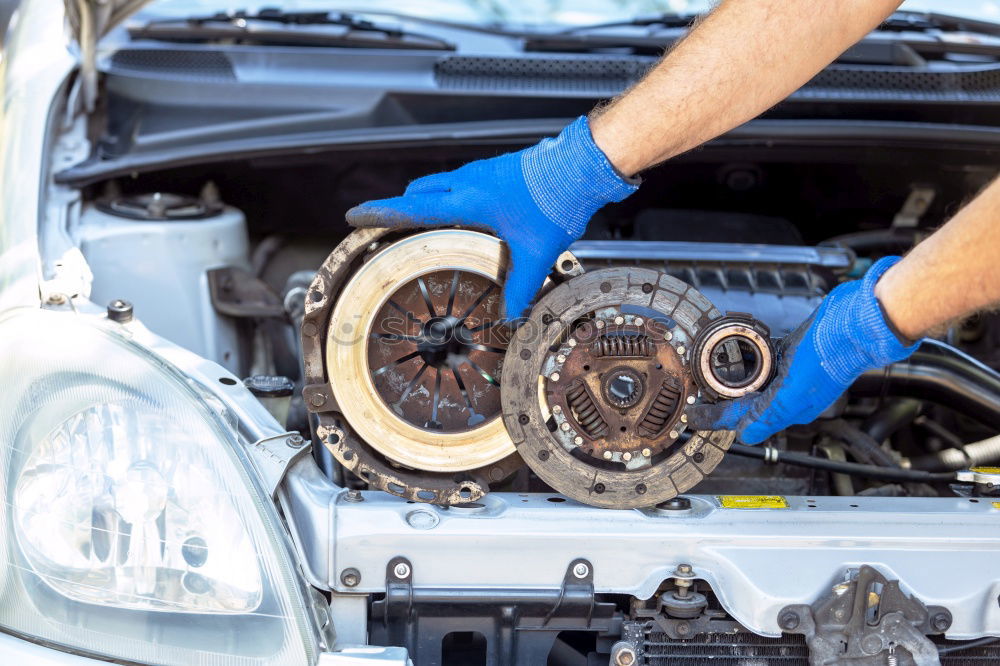 Similar – Professional Mechanic Repairing Car.