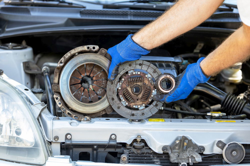 Similar – Professional Mechanic Repairing Car.