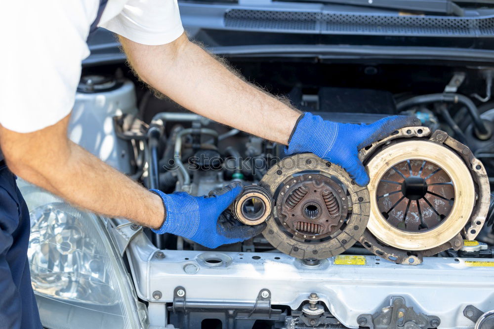 Similar – Professional Mechanic Repairing Car.