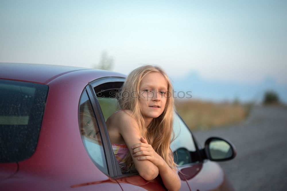 Similar – young woman in a car