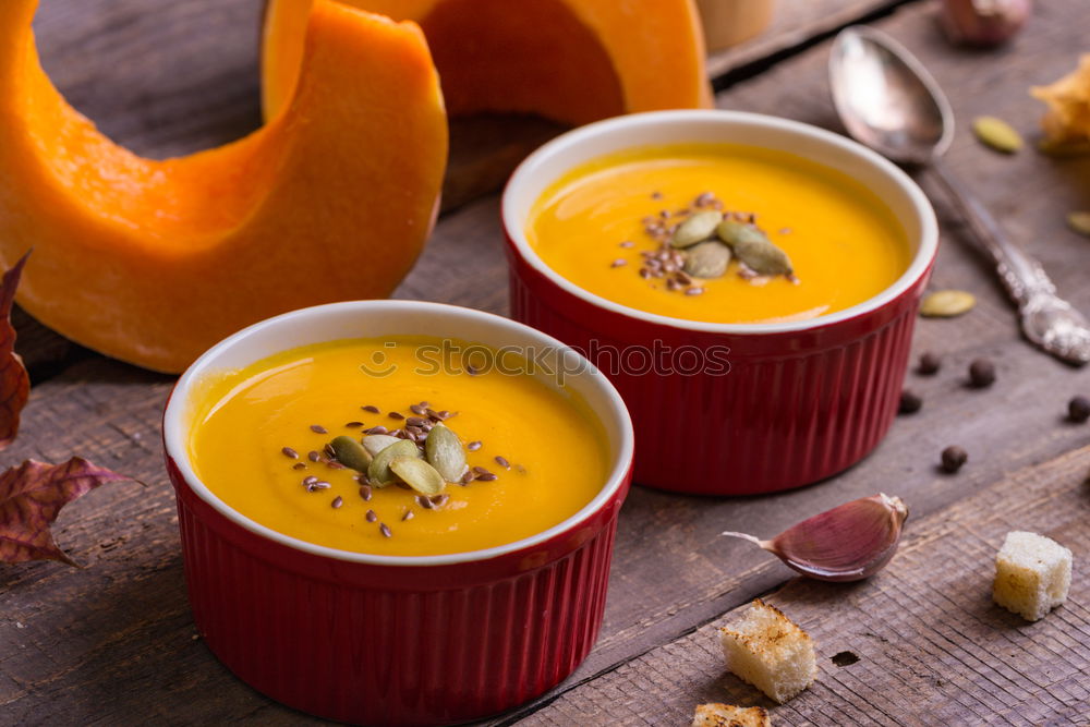 Similar – Fresh pumpkin soup in three bowls on a wooden table