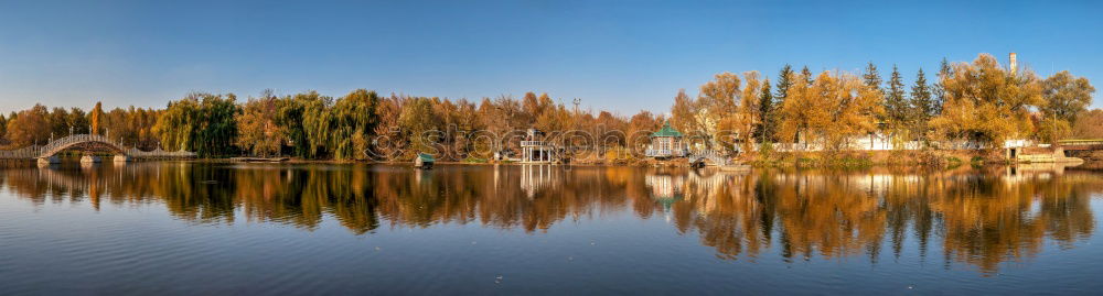 Similar – Tranquil, calm Rhine river scene with arched bridge