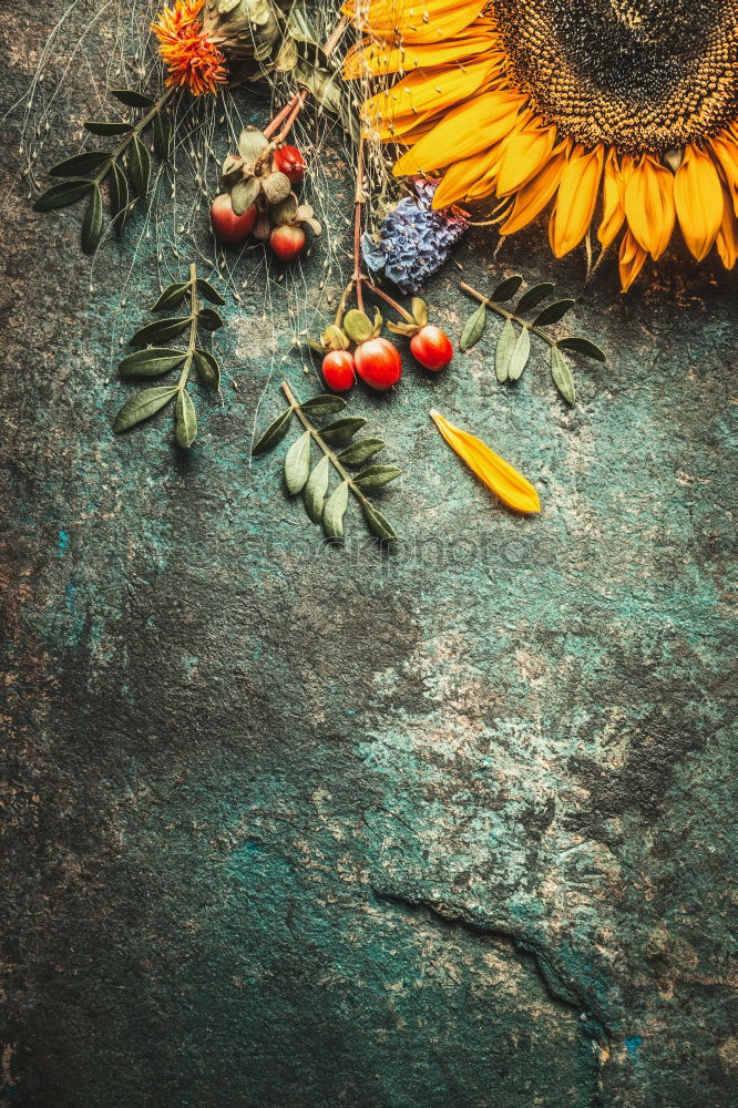 Female hands make autumn flowers decoration