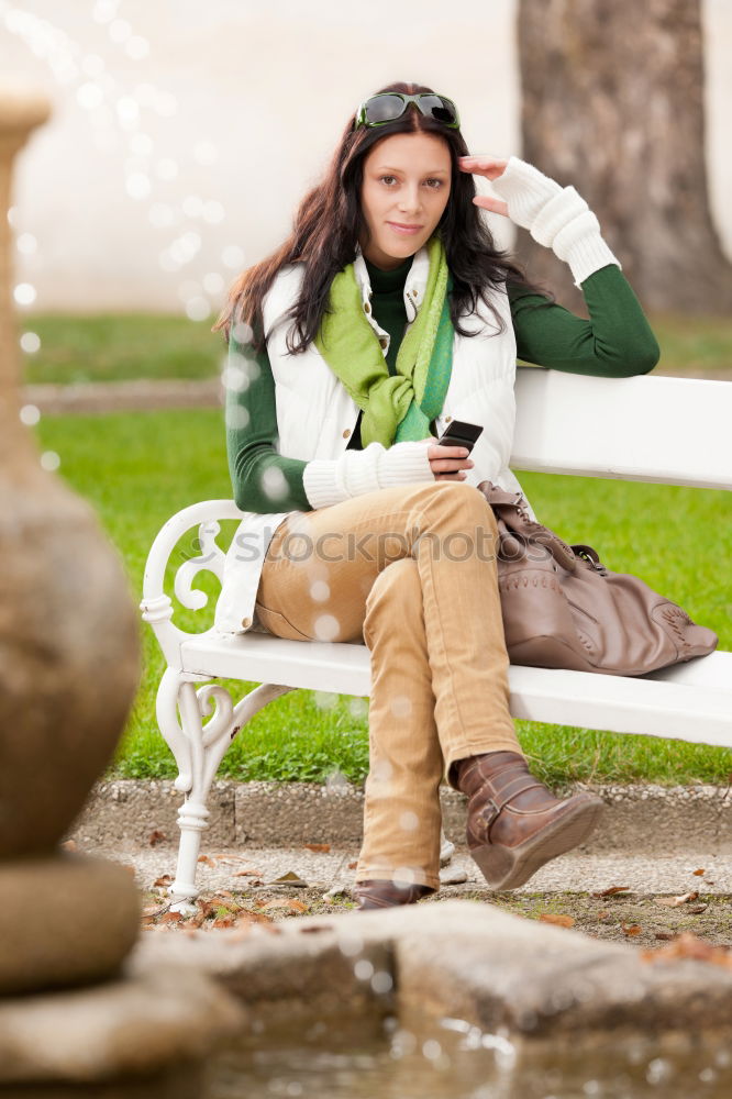 Similar – A young woman sitting on a garden bench