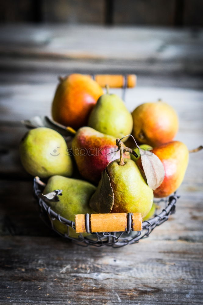 Similar – Image, Stock Photo Ripe yellow pears are scattered on the table