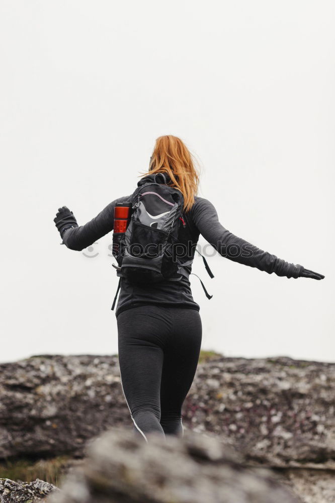 Similar – Image, Stock Photo jumping woman on a country road with mountains in the background