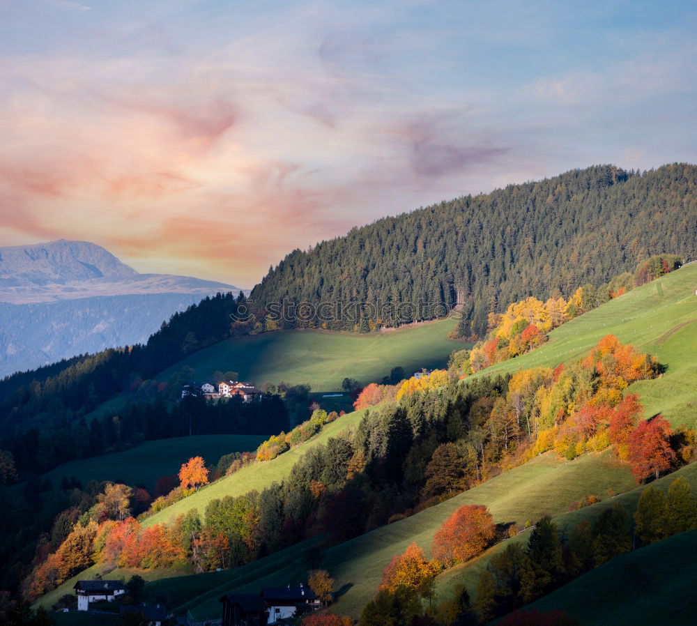 Austrian village on mountain hills in Alps