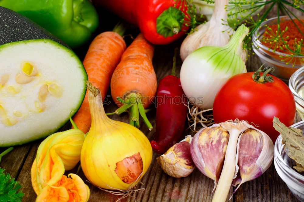 Similar – Vegetables and utensils on kitchen table