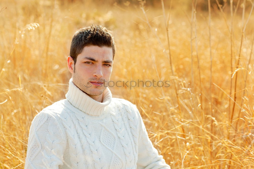 Similar – Image, Stock Photo Young man in a sunny autumn day