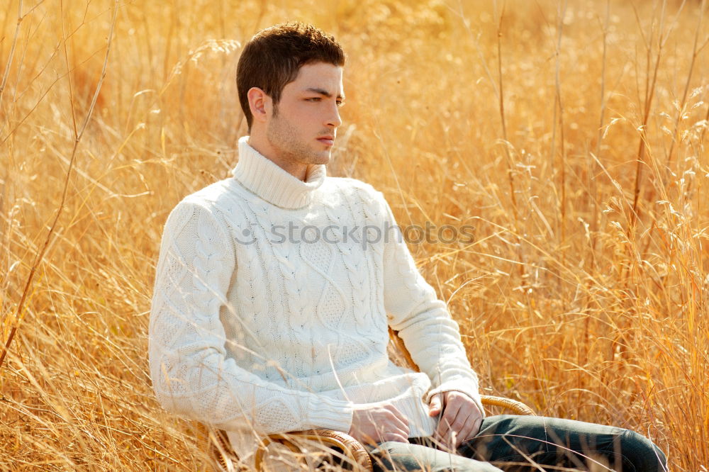 Similar – Image, Stock Photo Young man in a sunny autumn day