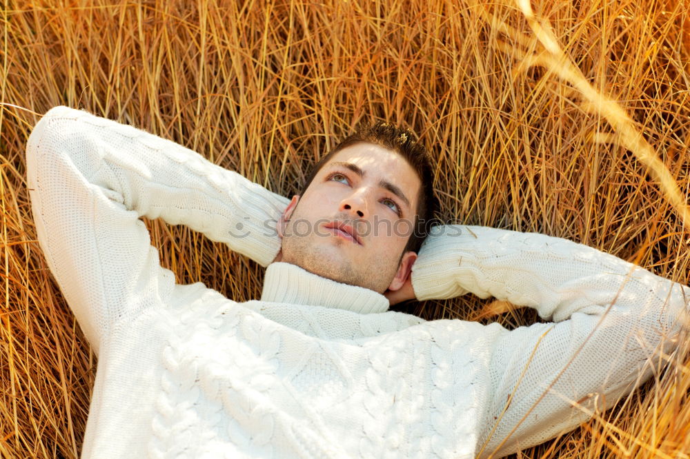 Similar – Image, Stock Photo Young man in a sunny autumn day