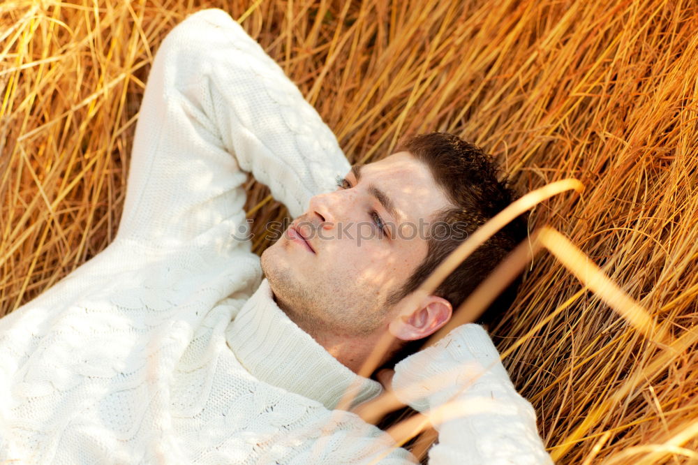 Similar – Image, Stock Photo Young man in a sunny autumn day