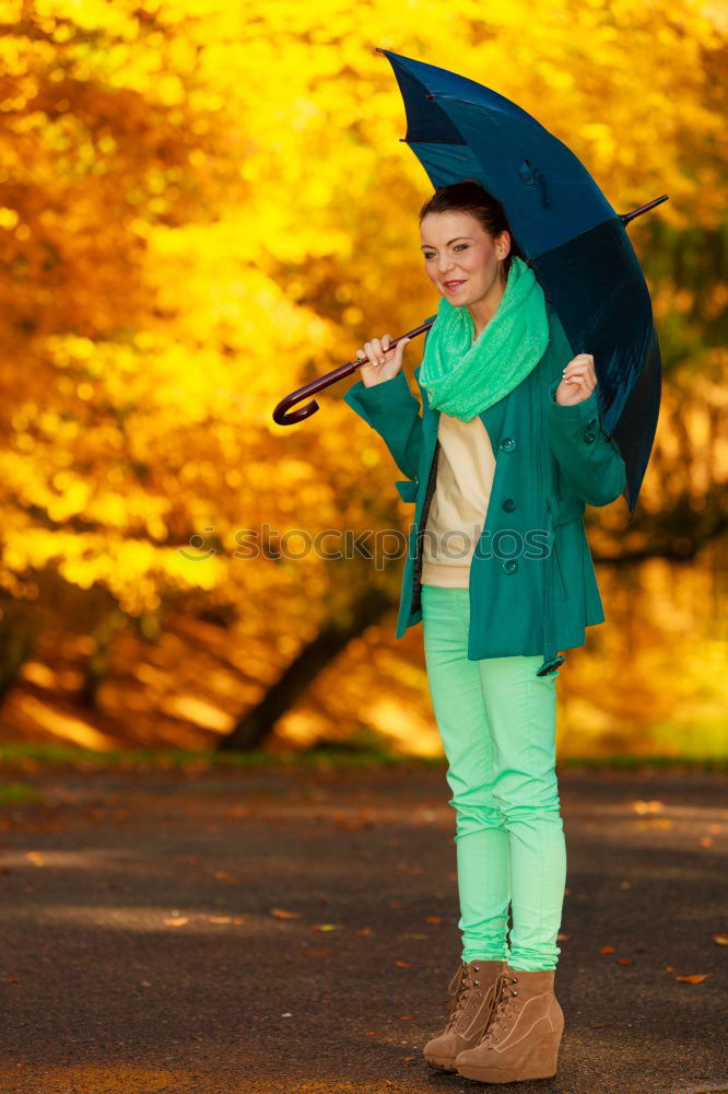 Similar – happy kid girl hiding under umbrella