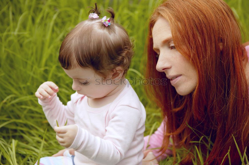 Similar – happy family: young mother walks with her child in the Park