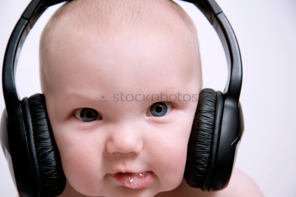 Similar – little boy with headphones