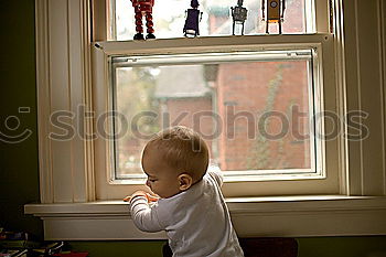 Similar – Image, Stock Photo Child looks curiously into the aquarium