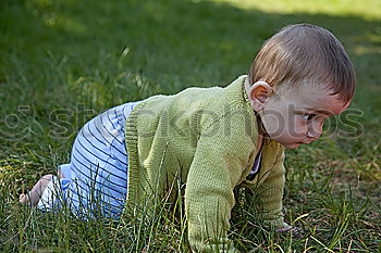 Similar – Girl climbs on boulder