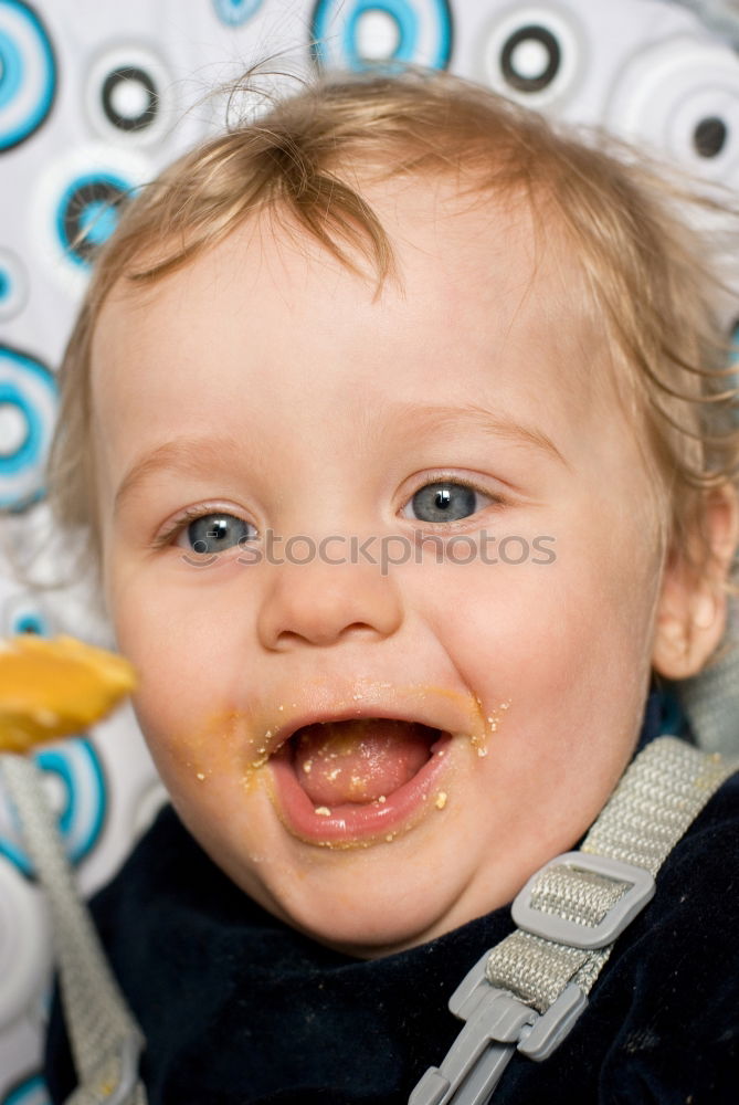 Similar – Daddy feeding toddler a spoonful of baby food