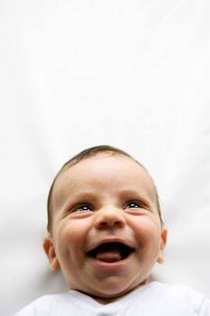 Similar – a happy baby boy sitting on a sofa and smilling