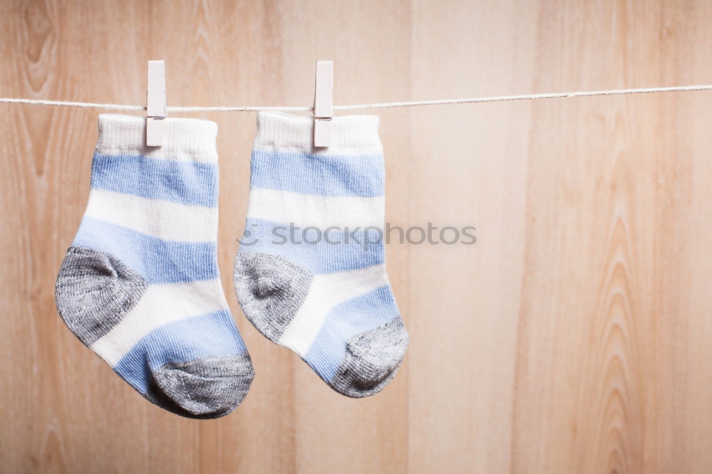 Similar – Image, Stock Photo Colorful socks and a pair of naked legs on white background