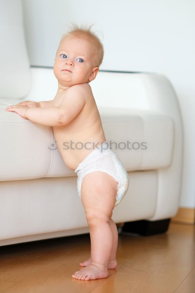 Similar – Baby in a bed in frame of heart shape. Out of focus baby