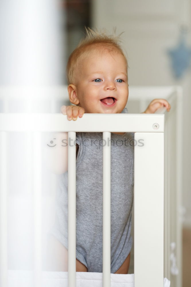 Similar – Cute Baby Girl Lying in the Crib