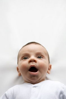 Similar – a happy baby boy sitting on a sofa and smilling