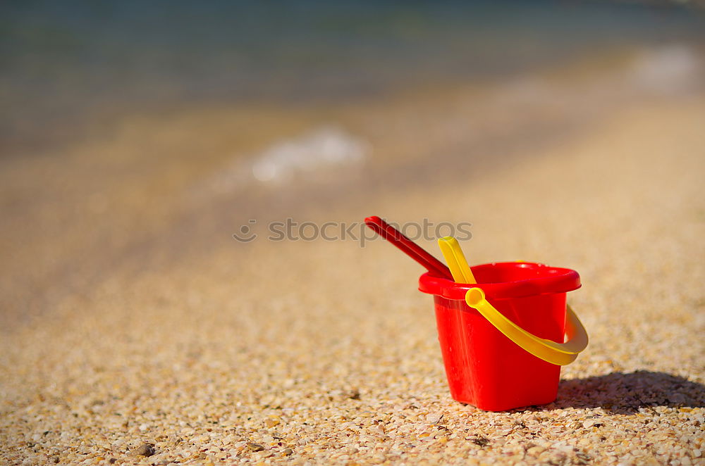 Similar – Image, Stock Photo Towel, beach ball, sunscreen and water gun on the beach