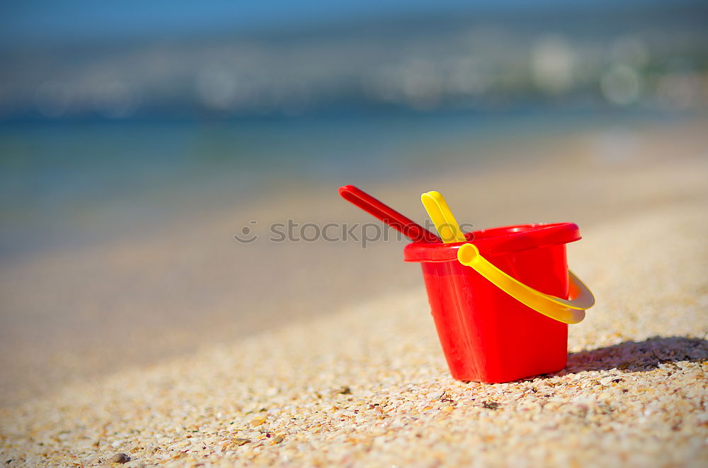 Similar – Image, Stock Photo Towel, beach ball, sunscreen and water gun on the beach