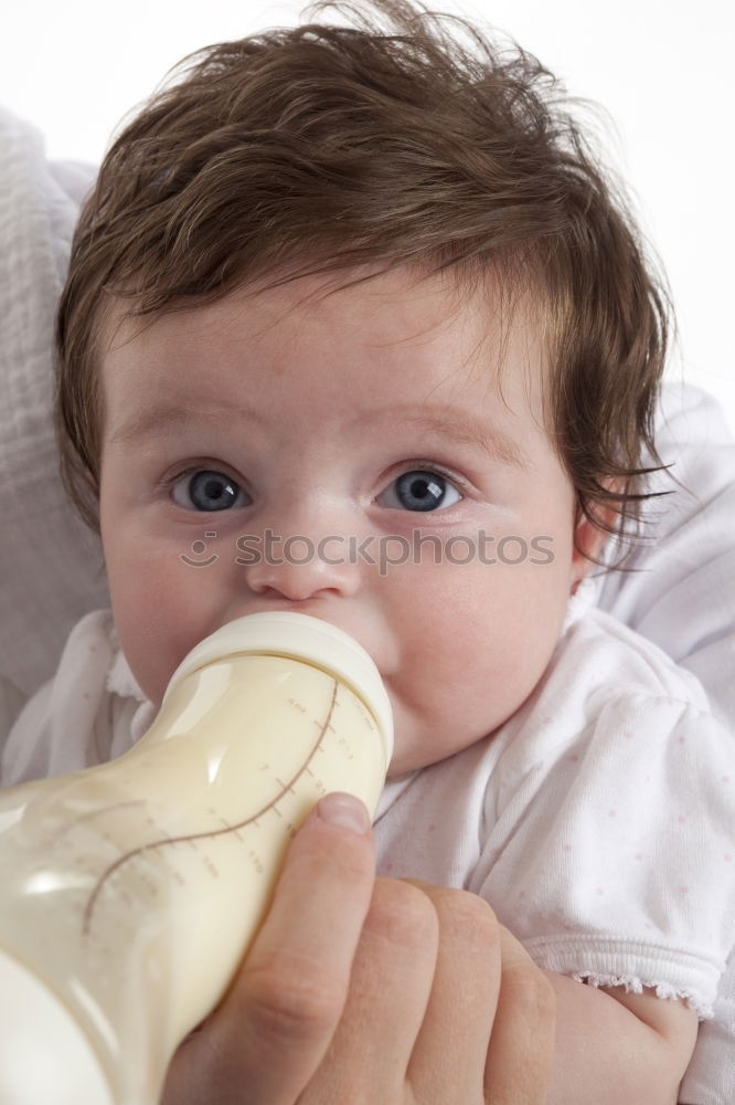 Similar – Baby taking feeding bottle