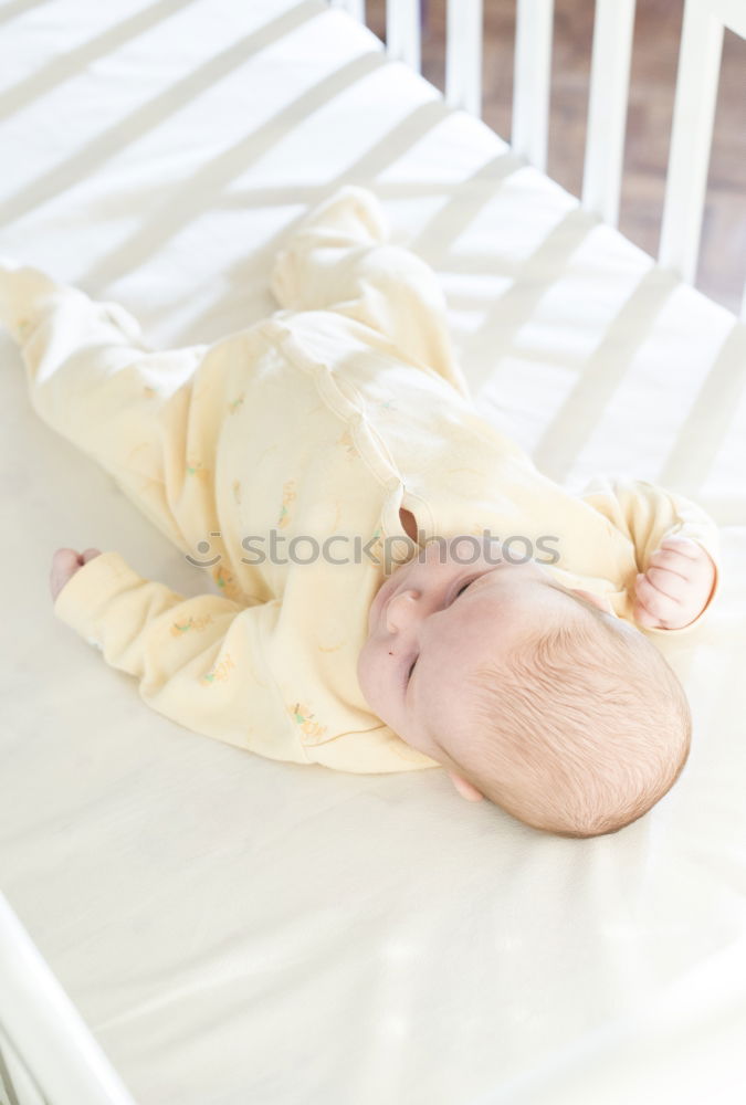 Similar – Cute Baby Girl Lying in the Crib