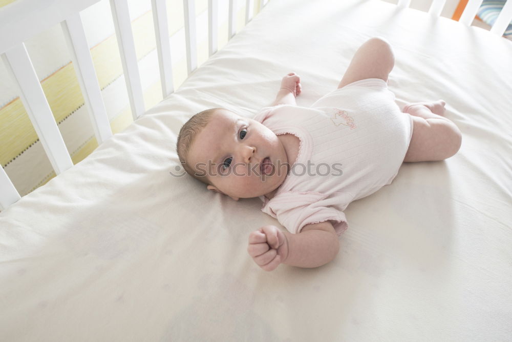 Similar – Cute Baby Girl Lying in the Crib