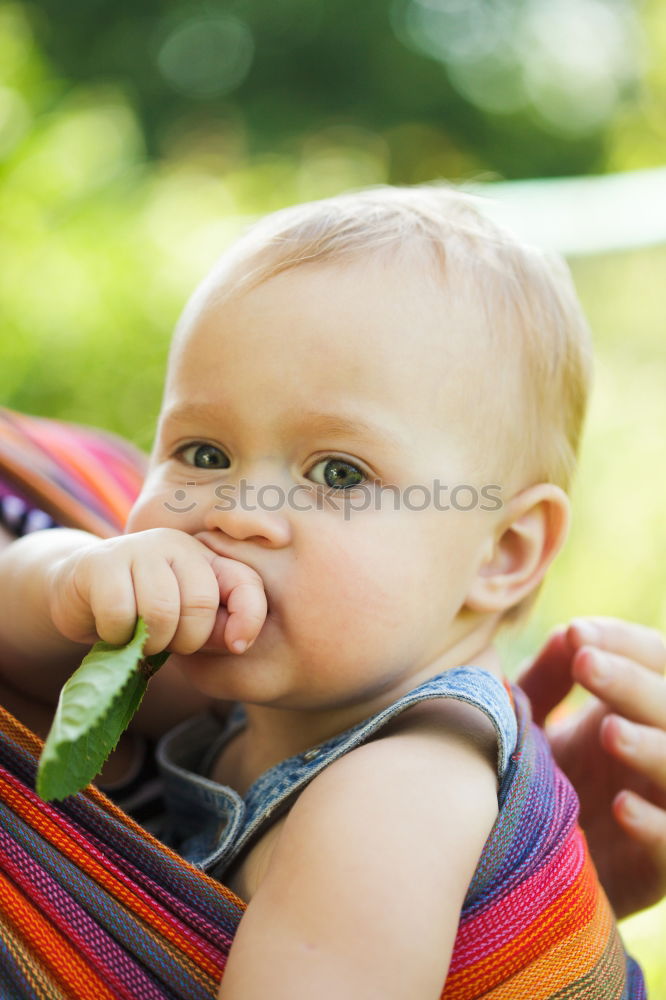 Similar – Image, Stock Photo Baby sucks on a bottle.