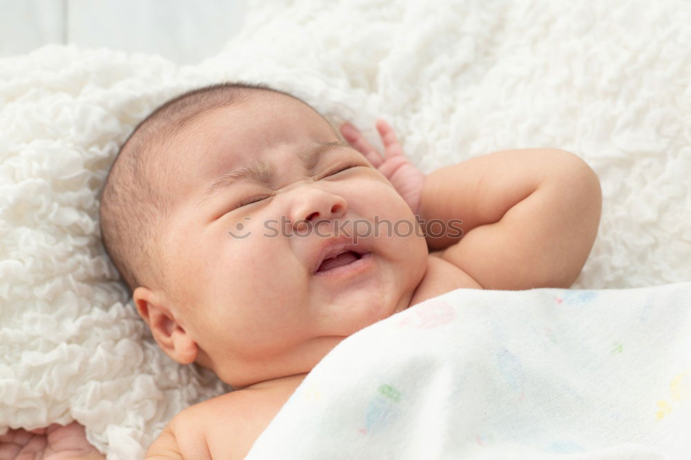 Similar – Image, Stock Photo Closeup shot of newborn baby lying on mother’s hand.