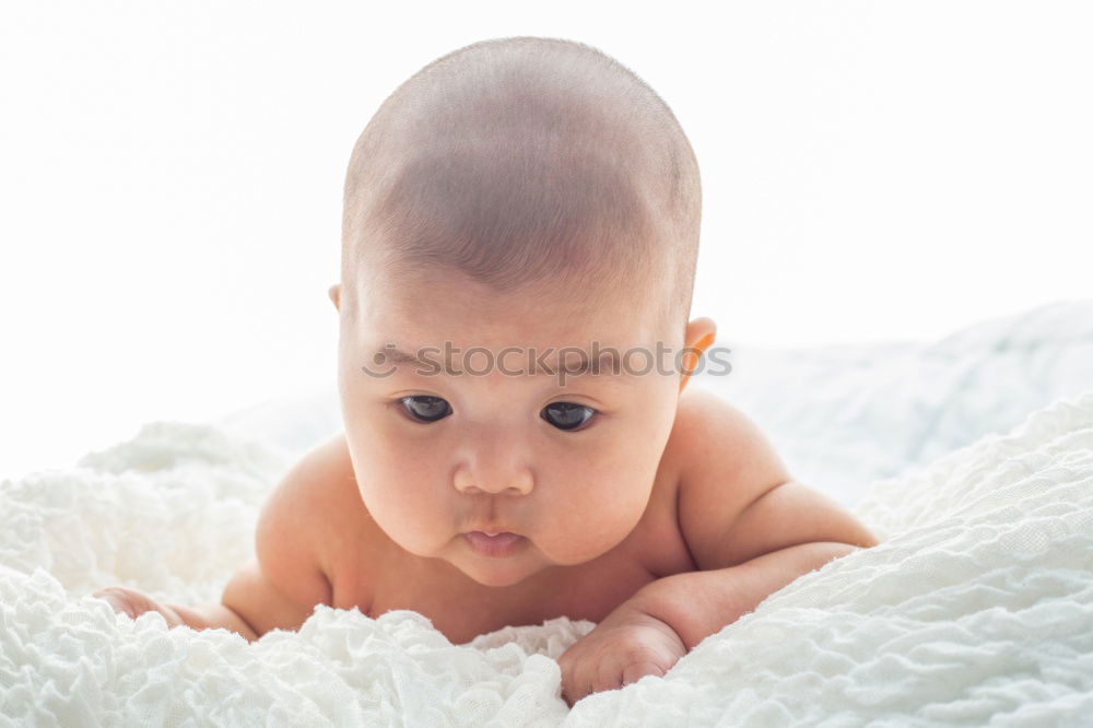 Similar – Cute Baby Girl Lying in the Crib