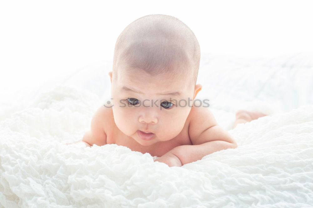 Cute Baby Girl Lying in the Crib