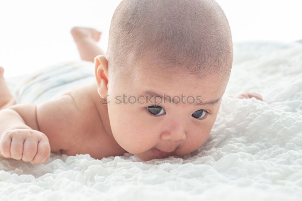 Similar – Cute Baby Girl Lying in the Crib