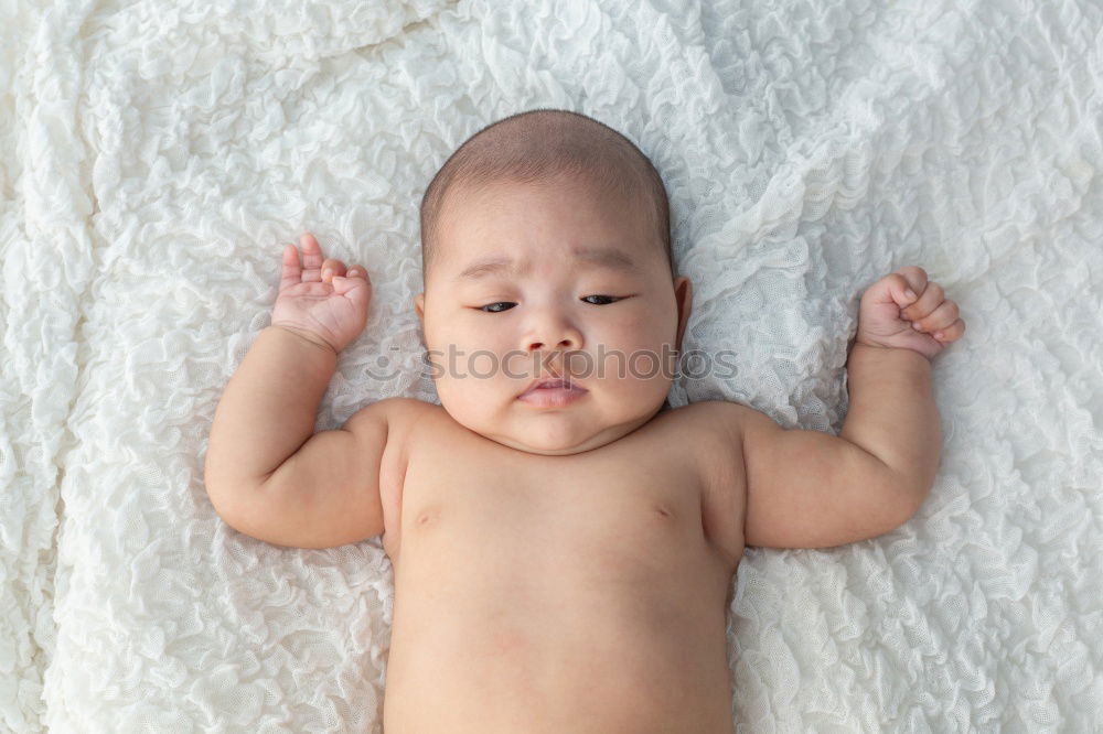 Similar – Image, Stock Photo newborn baby experiencing the world