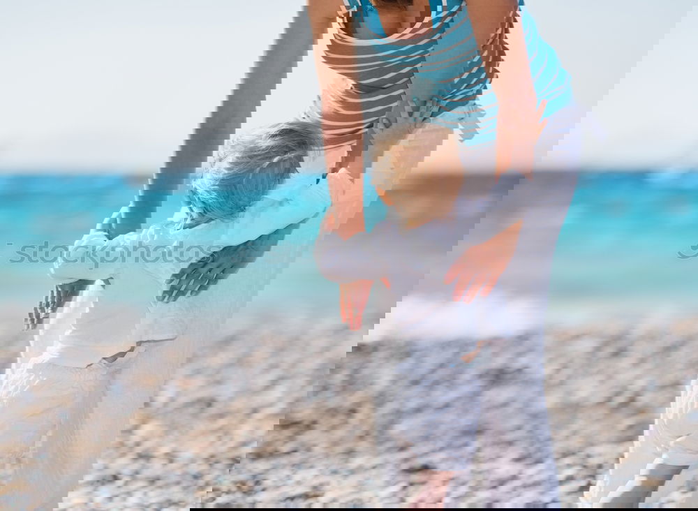 Similar – Image, Stock Photo Father and son playing on the beach at the day time.