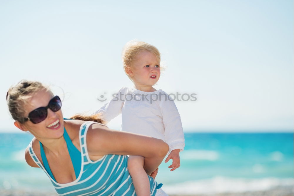 Similar – Image, Stock Photo Sister and brother playing on the beach at the day time.