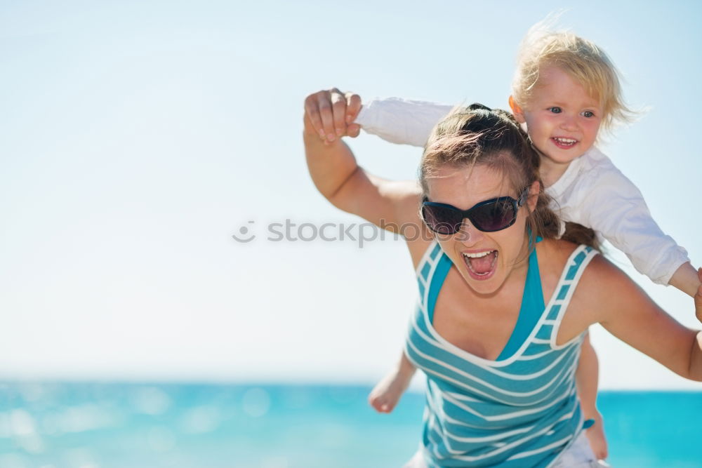 Similar – Image, Stock Photo Sister and brother playing on the beach at the day time.