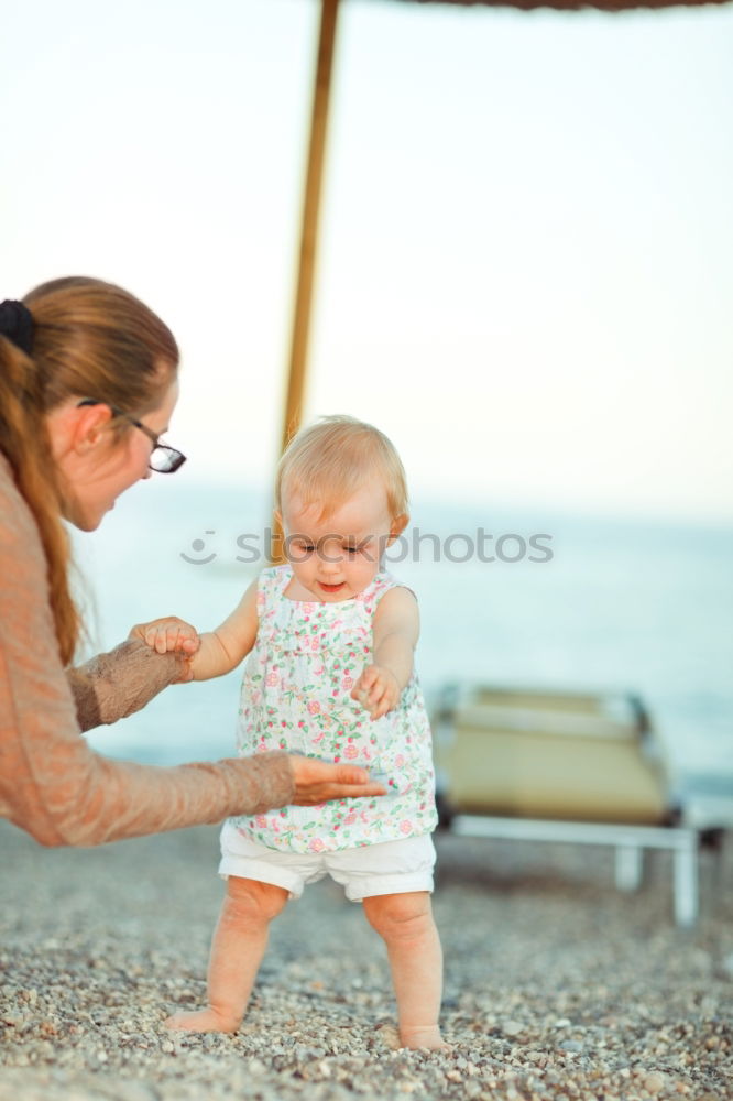 Similar – mother looking with admiration at baby child